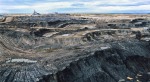 Aerial view of Syncrude strip mine in the Alberta Tar Sands; Photo copyright Garth Lenz